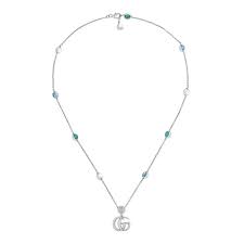 Double G Necklace with Mother of Pearl and Blue Topaz Stations